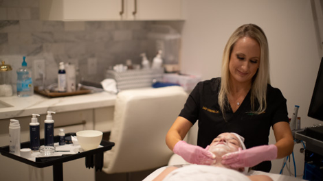 Skin care A woman receiving anti-aging treatment at Vibrant Skin Bar by Jalair Whitman
