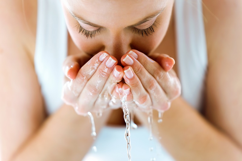 Washing the face after a Botox treatment.