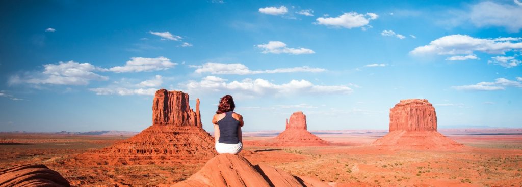 A woman practicing mindfulness in a desert